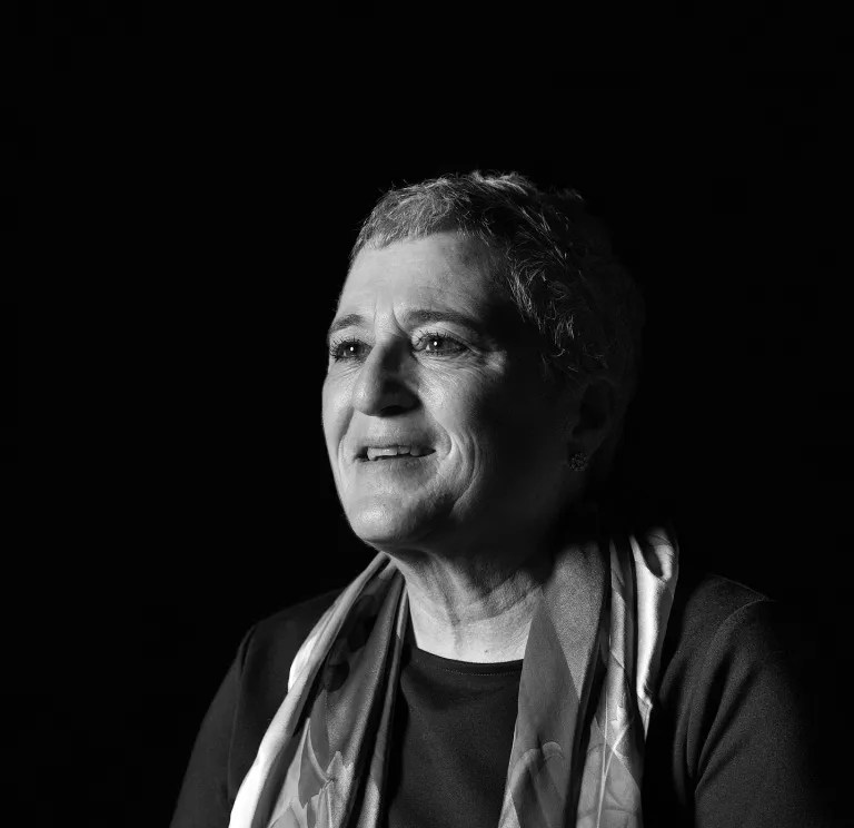 A black and white portrait of animal health expert Laura Kramer.
