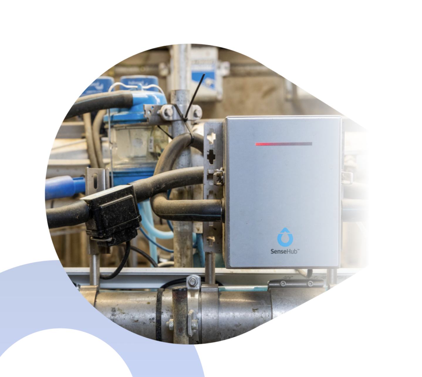 Close-up of pipes and wiring connected to SenseHub device